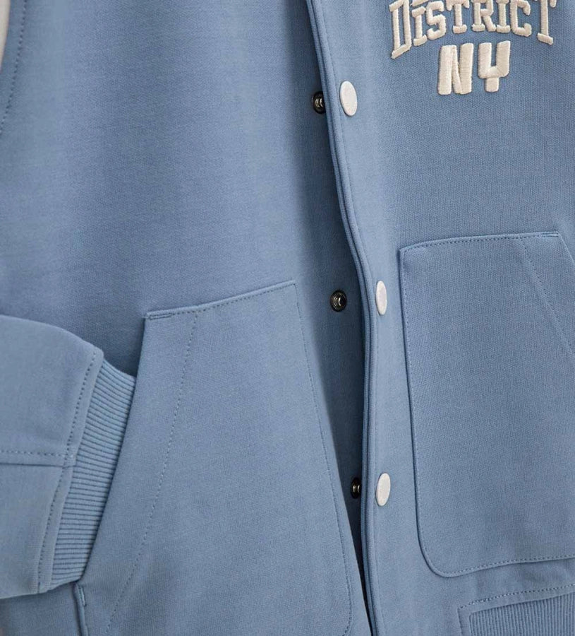 Γαλάζιο παιδικό bomber jacket Original Marines με λευκές λεπτομέρειες και τύπωμα "DENIM DISTRICT NY" στο στήθος, για αγόρια 5-14 ετών.